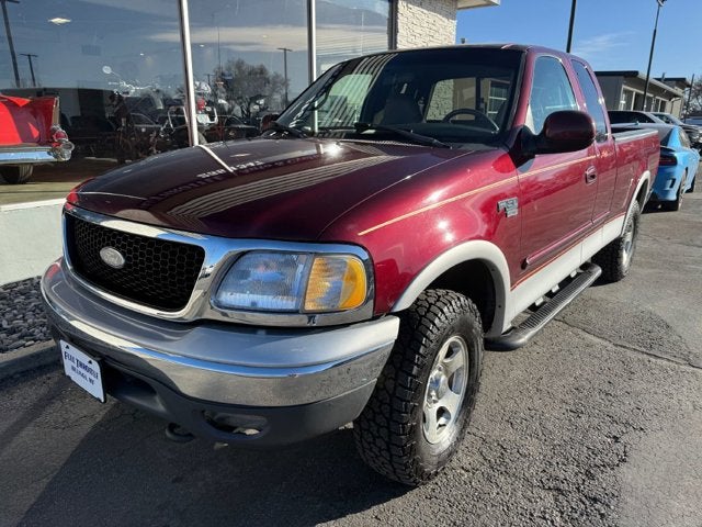 1999 Ford F-150 Lariat in Maroon — front three-quarter view